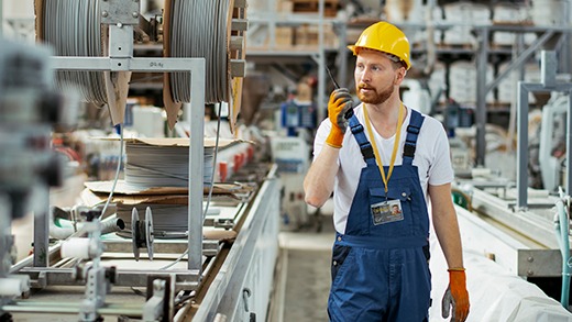 an employee in an industrial company wearing a badgy identification badge