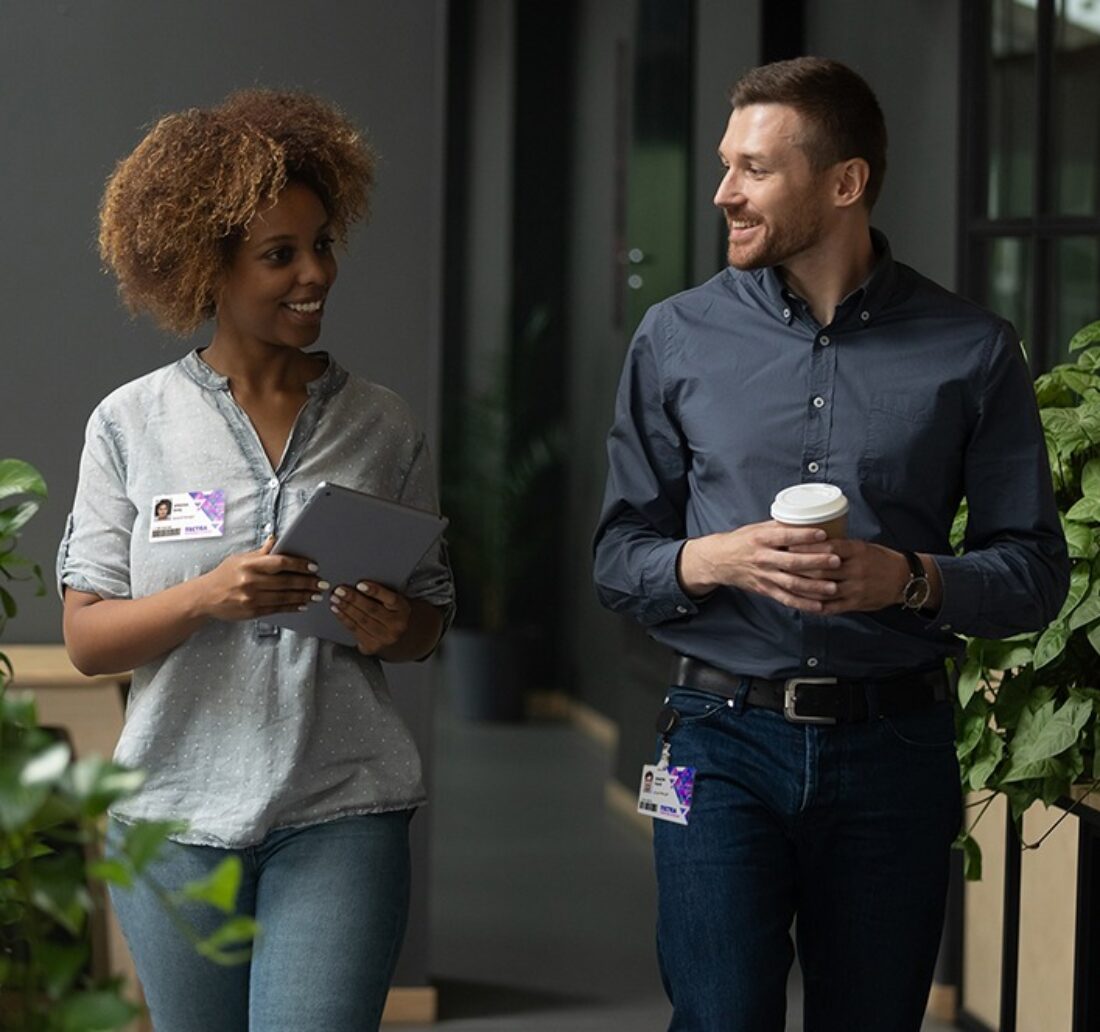 two corporate employees wearing a badgy identification badge